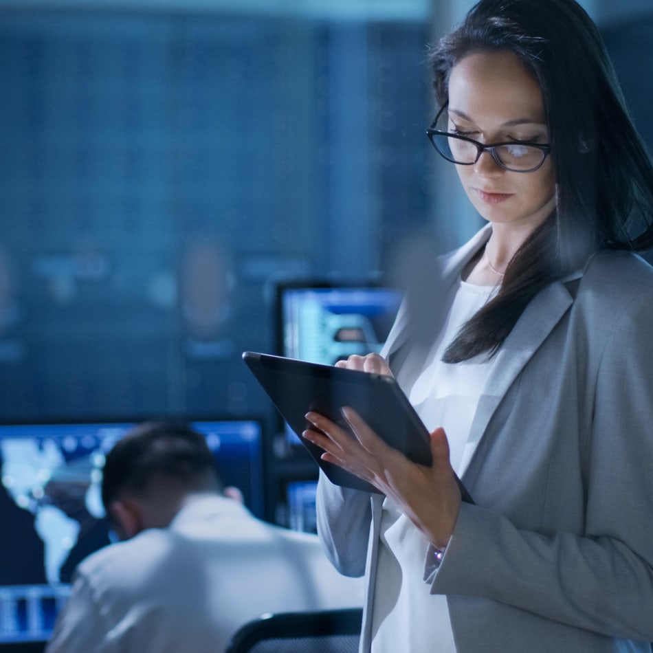 Cybersecurity professional working on tablet