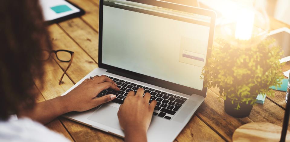 Adult woman working on laptop computer