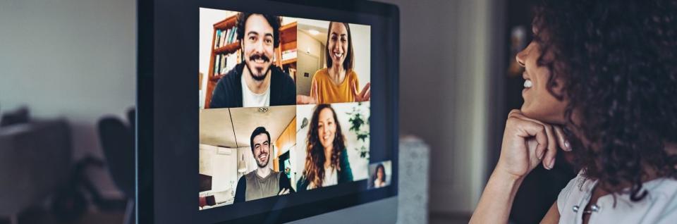 Inclusive leader facilitating virtual meeting with her remote team.